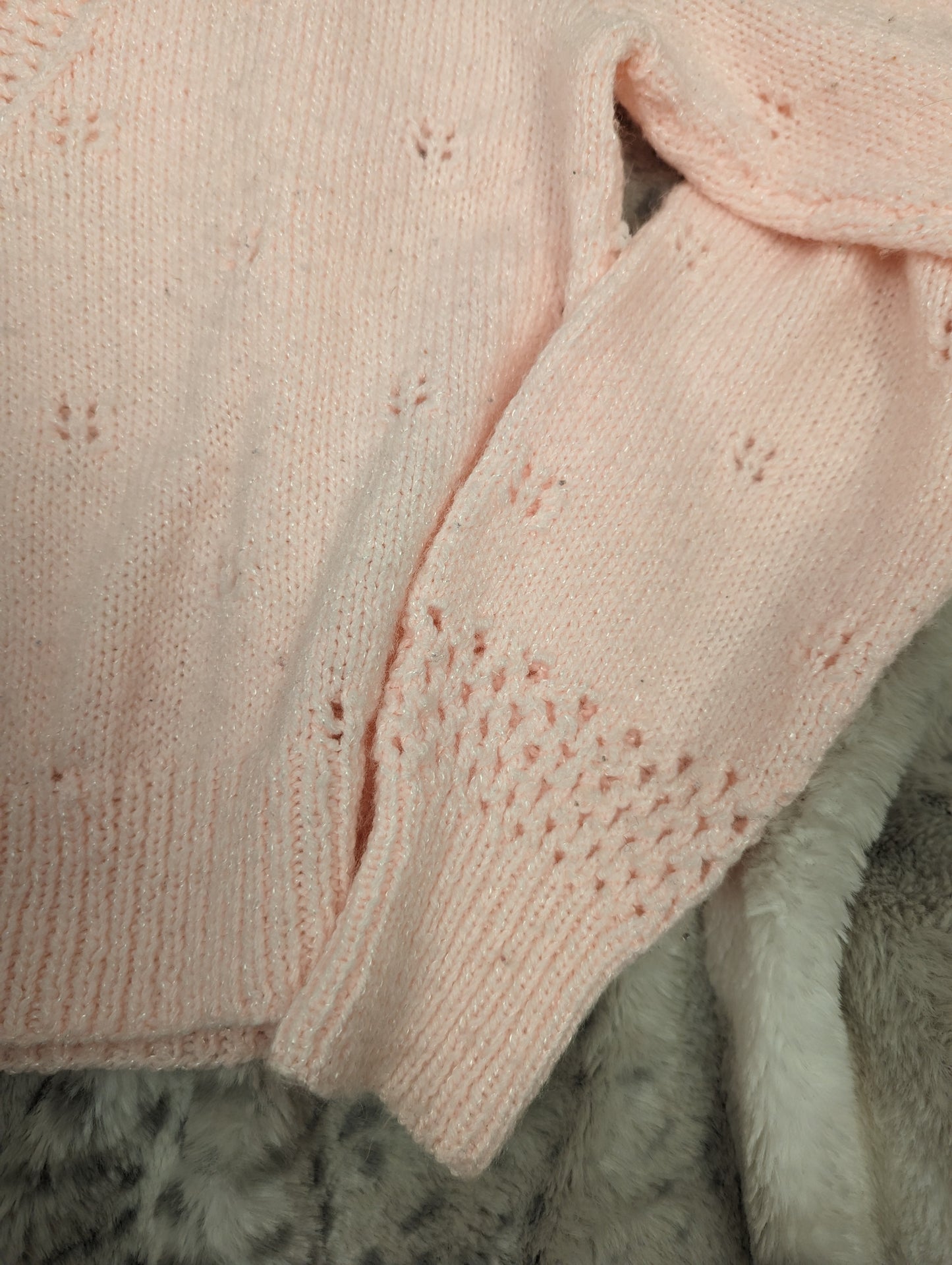 Handknitted pink sweater